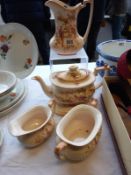 A Crown Ducal 5 piece tea set (small chip to teapot lid)