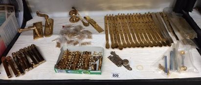 A good lot of brass door and window fittings.