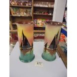 A pair of Doulton style hand painted vases, one a/f.