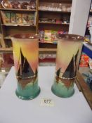 A pair of Doulton style hand painted vases, one a/f.