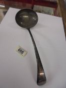 A silverplate soup ladle.