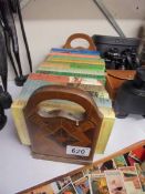 A Inlaid book rack with books including reference.