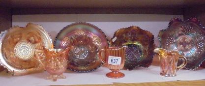 Four carnival glass dishes and three jugs.