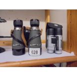 A cased pair of National Trust binoculars and one other.