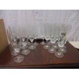 Two sets of ten drinking glasses.