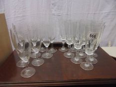 Two sets of ten drinking glasses.