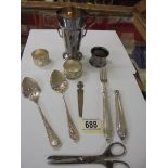 A mixed lot including napkin rings, cutlery etc.,