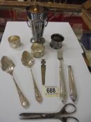 A mixed lot including napkin rings, cutlery etc.,