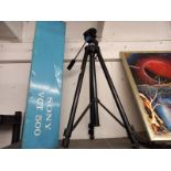 A boxed camera tripod.