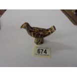 A ceramic bird whistle.