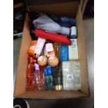 A box of ladies toiletries and seven umbrella's.