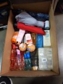 A box of ladies toiletries and seven umbrella's.