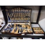 An art deco oak cased canteen of cutlery (looks unused) and a set of coffee spoons.