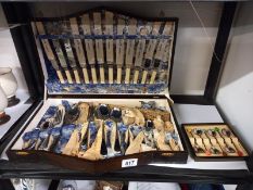 An art deco oak cased canteen of cutlery (looks unused) and a set of coffee spoons.