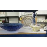 A glass cake plate and two glass bowls.