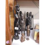 Ten carved wood tribal figures.
