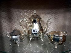 A three piece silver plate tea set.