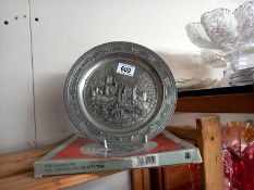 A boxed WMF plate with embossed castle scene.