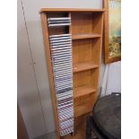 A CD shelf and large quantity of CD's.