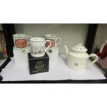 Three boxed Betty's tea rooms York mugs and a Leeds Betty teapot.