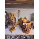 Two carved wood birds, Two Scottish themed tankard and a wooden fork.