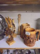 Two carved wood birds, Two Scottish themed tankard and a wooden fork.