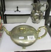 A decorative silver plate tea pot and a hot water jug.