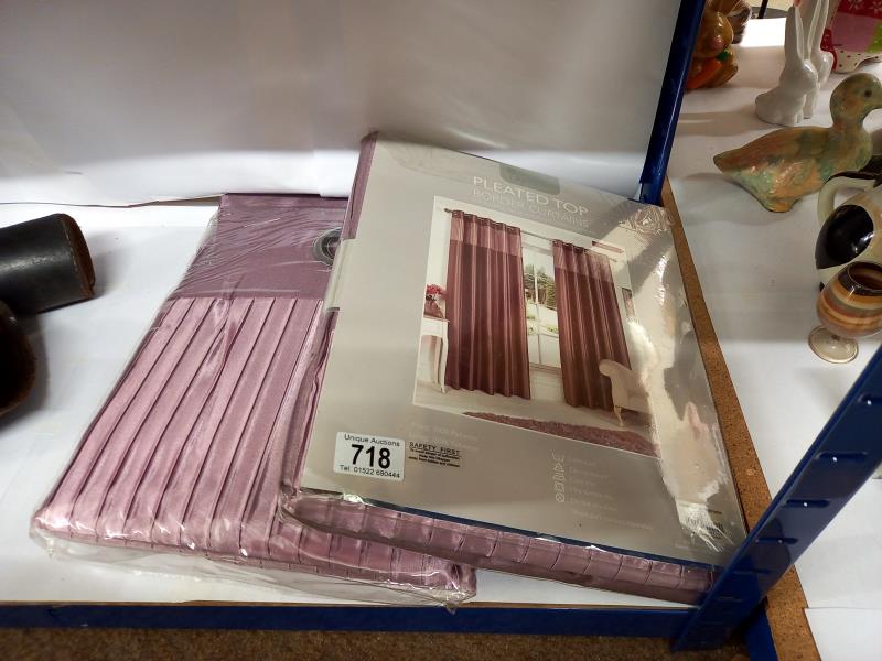 Two pairs of eyelet top border curtains in mauve, 46" drop x 72" wide, new in bags.