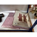 Two pairs of eyelet top border curtains in mauve, 46" drop x 72" wide, new in bags.