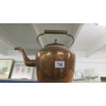 A large copper kettle.