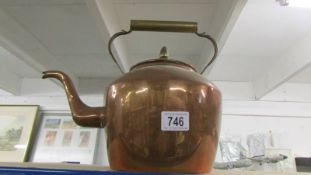 A large copper kettle.