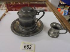 A pewter inkwell with glass liner and a 1/24 pewter measure.