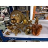 A mixed lot of brass ware including bell, candlesticks etc.,