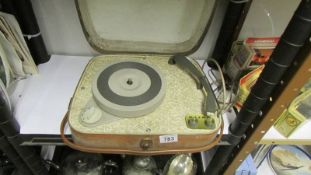 A vintage portable record player.