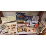 A collection of Titanic related books and Cunard Line postcards.