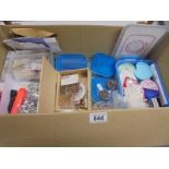 A box of assorted jewellery making materials.