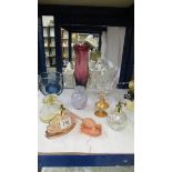 A mixed lot of coloured glass ware including perfume bottles.