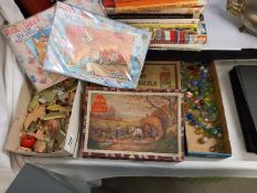 A quantity of vintage jigsaw puzzles (completeness unknown) marbles etc.,