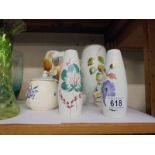 Four vases, a jam pot, salt and pepper pots including Poole Pottery.