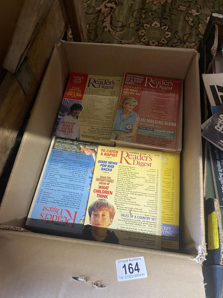 A box of Readers Digest magazines