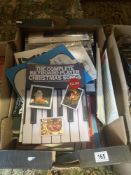 A box of music related books and scores