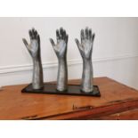 Set of early 20th C. polished metal glove makers hands.