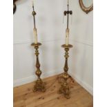 Pair of carved giltwood ecclesiastical standard lamps.