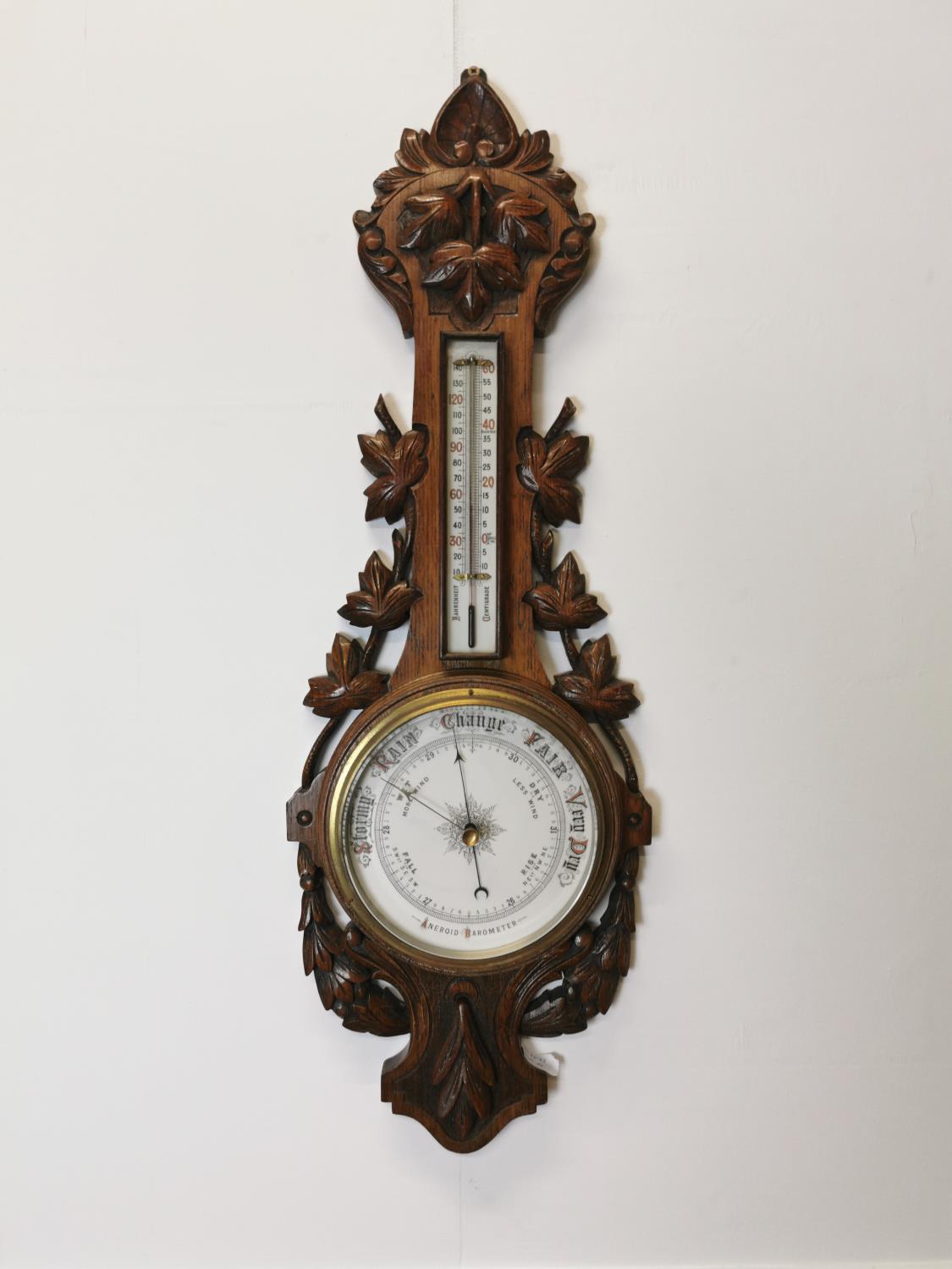 Edwardian carved oak barometer