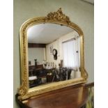 Decorative gilt over mantle mirror.