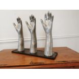 Set of early 20th C. polished metal glove makers hands.