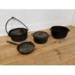 Three early 20th C. cast iron pots and frying pan.