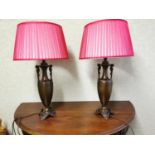 Pair of bronze spelter table lamps with shades.