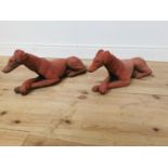 Pair of moulded terracotta reclining whippets.