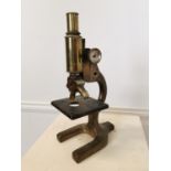 Early 20th C. brass microscope.